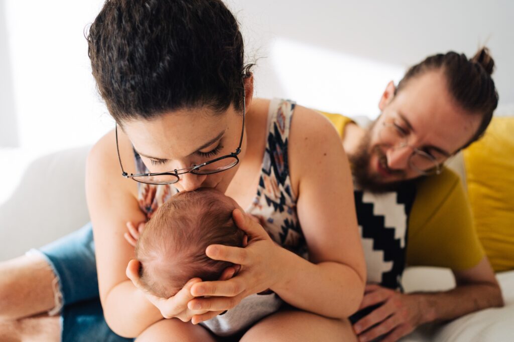new mum & dad with their baby
